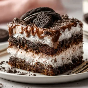 Oreo lasagna layered dessert with chocolate and cream
